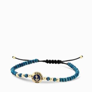 bracciale a monetina in oro giallo con zaffiri e ancora ed ematite blu