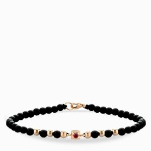 bracciale laccio con conice in oro rosa punto luce centrale con rubino