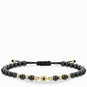bracciale laccio con ceramica in oro giallo con punto luce centrale di diamante nero