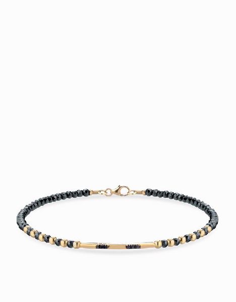 bracciale con ematite sfere in oro giallo e bacchetta smile con diamanti neri