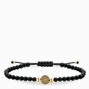 bracciale laccio onice in oro giallo con monetina rosa dei venti centrale