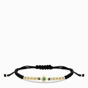 bracciale laccio in oro giallo con punto luce smeraldo centrale