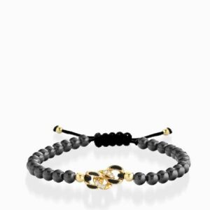 bracciale in oro giallo con palline e grumetta centrale di diamanti smaltata