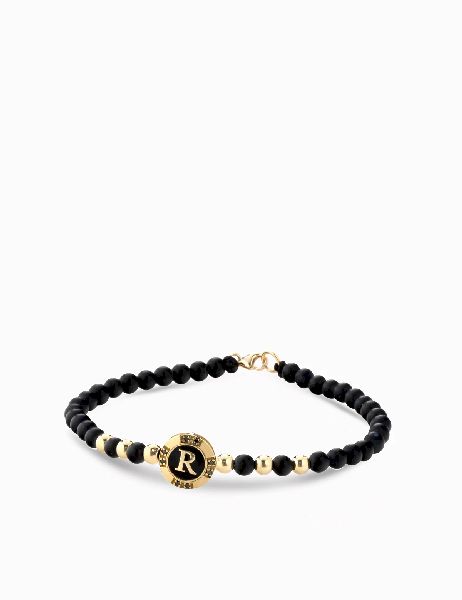 bracciale monetina con onice in oro giallo e diamanti neri con lettera personalizzata