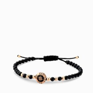 bracciale a monetina in oro rosa con diamanti e rosa dei venti ed onice