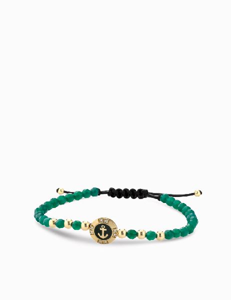 bracciale a monetina in oro giallo con diamanti e ancora ed ematite verde