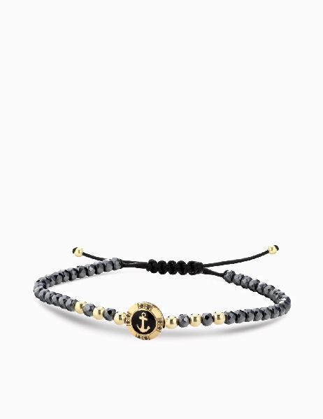 bracciale a monetina in oro giallo con diamanti neri e ancora ed ematite grigia