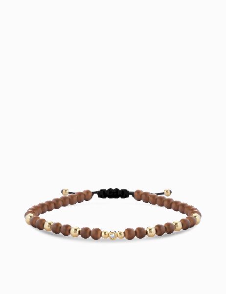 bracciale in oro giallo con diamantino e onice marrone