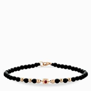 bracciale laccio con conice in oro rosa punto luce centrale con rubino
