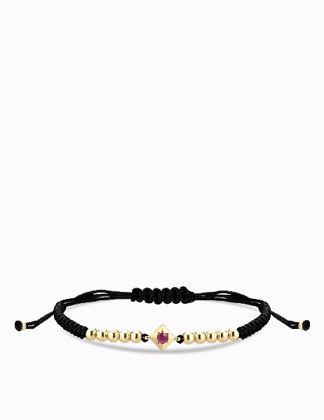 bracciale laccio in oro giallo con punto luce di rubino centrale