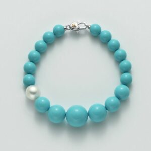 Bracciale in aulite di diverse dimensioni turchese con perla bianca