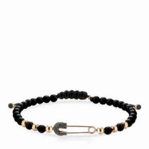 bracciale a sfere in onice e oro rosa e spilla con diamanti neri