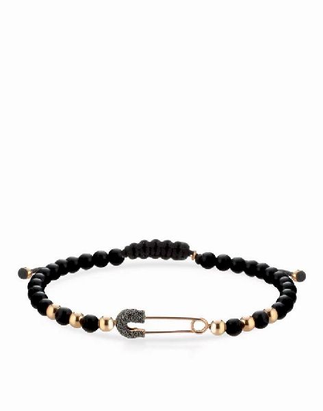 bracciale a sfere in onice e oro rosa e spilla con diamanti neri