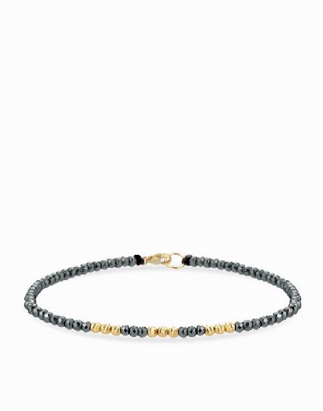 bracciale a laccio con ematite e sfere in oro giallo 1