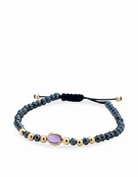 bracciale con sfere in ematite e oro giallo con pietra centrale rosa