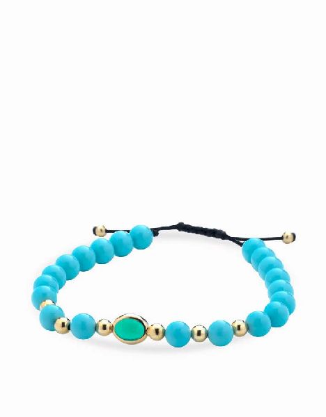 bracciale con sfere in ceramica azzurra e oro giallo con pietra centrale verde