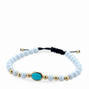 bracciale con palline bianche in ceramica e oro giallo e pietra centrale azzurra