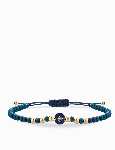 bracciale laccio in oro giallo ematite blu con monetina rosa dei venti con diamanti