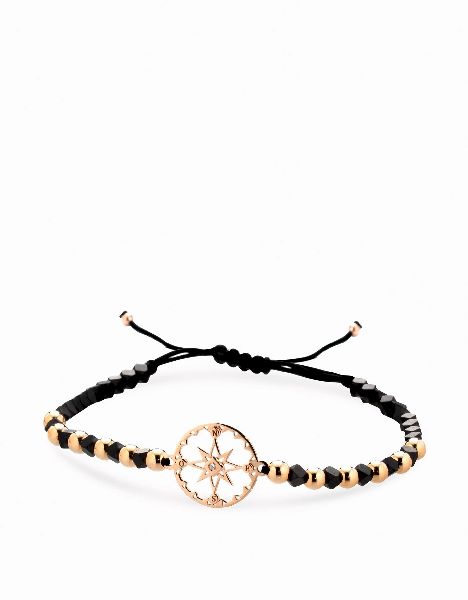 bracciale in cordino sfere in ematite briole e oro e rosa dei venti in oro rosa e diamante