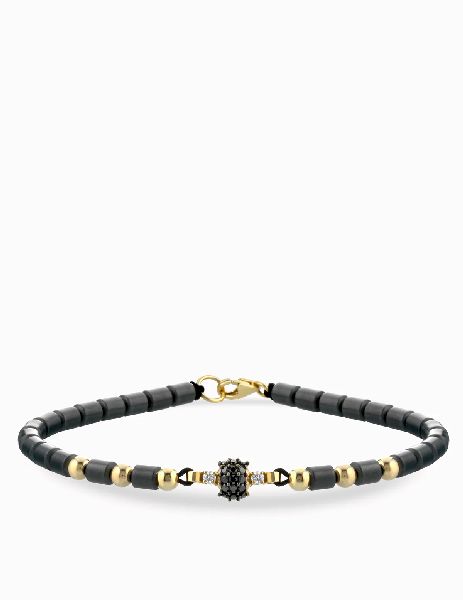 bracciale laccio in oro giallo con emtatie e centrale di diamanti bianchi e diamanti neri