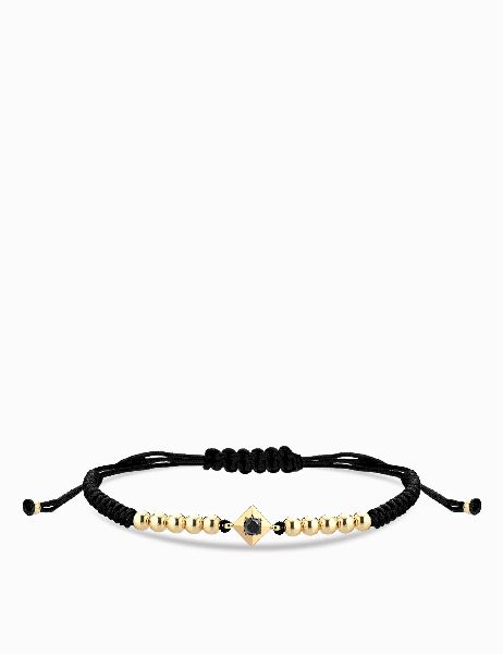 bracciale laccio in oro giallo con punto luce di diamnte nero centrale