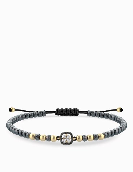 bracciale laccio con emtatie e palline in oro giallo centrale di diamanti bianchi e neri