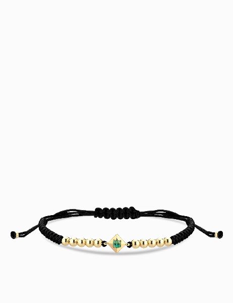 bracciale laccio in oro giallo con punto luce smeraldo centrale