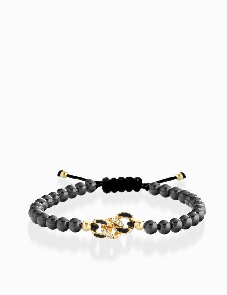 bracciale in oro giallo con palline e grumetta centrale di diamanti smaltata