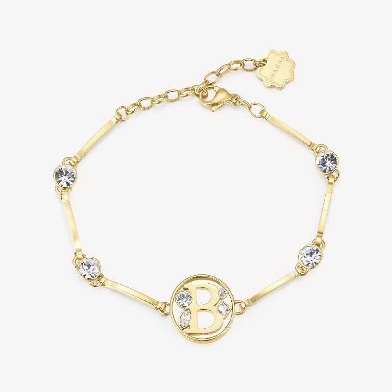 Bracciale in acciaio 316L e finitura color oro con lettera e cristalli crystal.