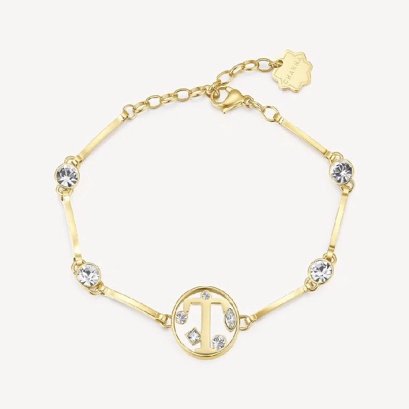 Bracciale in acciaio 316L e finitura color oro con lettera e cristalli crystal.