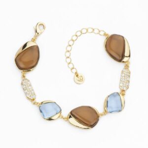Bracciale gocce bombate in cristallo azzurro e topazio con frame in brass dorato ed elementi in pav&egrave; di zirconi clear - Misura Regolabile