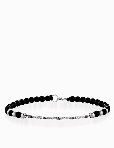 bracciale con laccio e chiusura in oro bianco bacchetta di diamanti neri e diamanti
