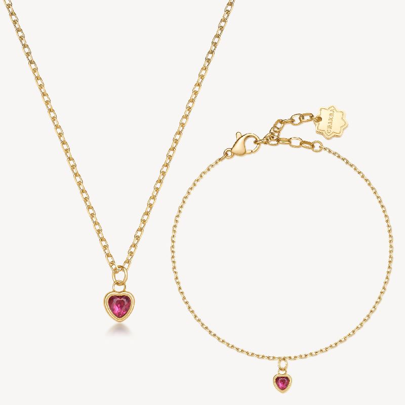 Collana + bracciale CHAKRA in acciaio 316L, finitura pvd colore oro, con pendente cuore con cristallo ruby
