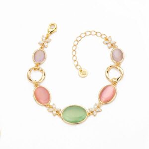 Bracciale elementi torchon in brass dorato intervallati da fiori in zirconi navette clear e cat eye tanzanite, rosa e mela - Misura Regolabile