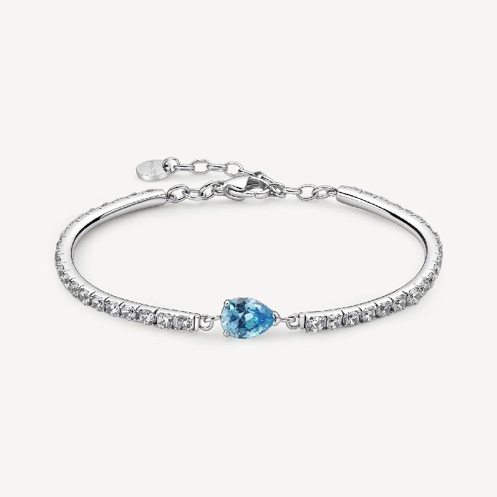 Bracciale semirigido in acciaio 316L con cubic zirconia chiari ed elemento centrale pear cubic zirconia colore acquamarina.