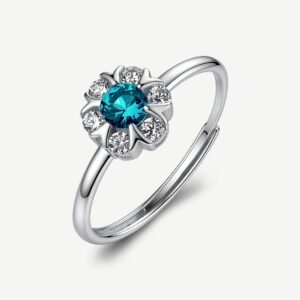 Anello regolabile in argento rodiato 925&permil; a forma di fiore, con cubic zirconia chiari e cubic zirconia colore paraiba.
