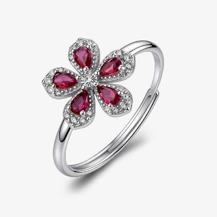 Anello regolabile in argento rodiato 925‰ a forma di fiore, con cubic zirconia chiari e cubic zirconia colore ruby.