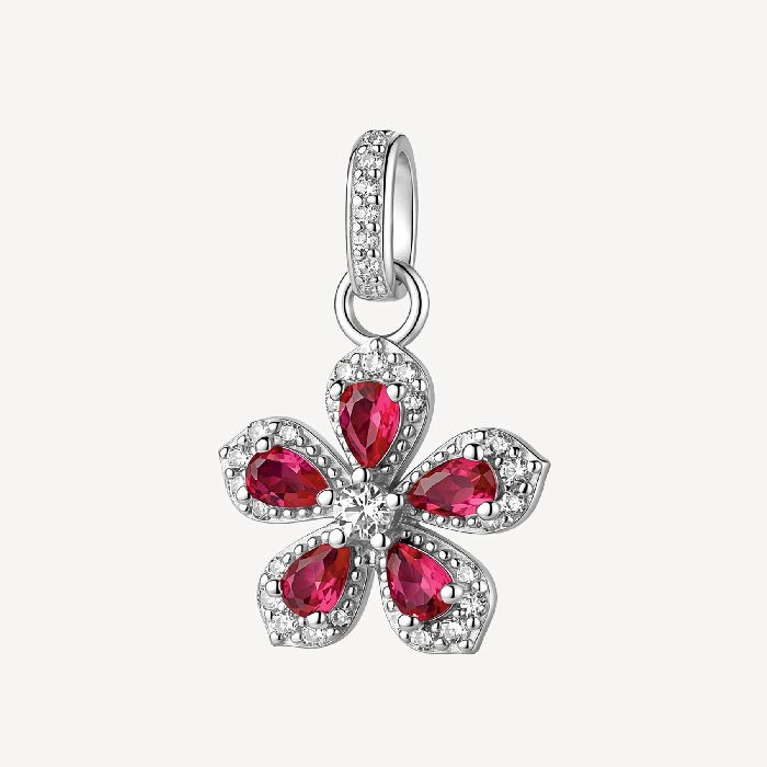 Pendente in argento rodiato 925‰ a forma di fiore, con cubic zirconia chiari e cubic zirconia colore ruby.
